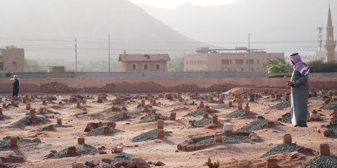 A man standing in a large field of rocks