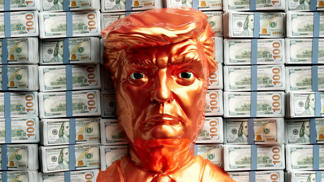 A golden trump head stands before stacks of money