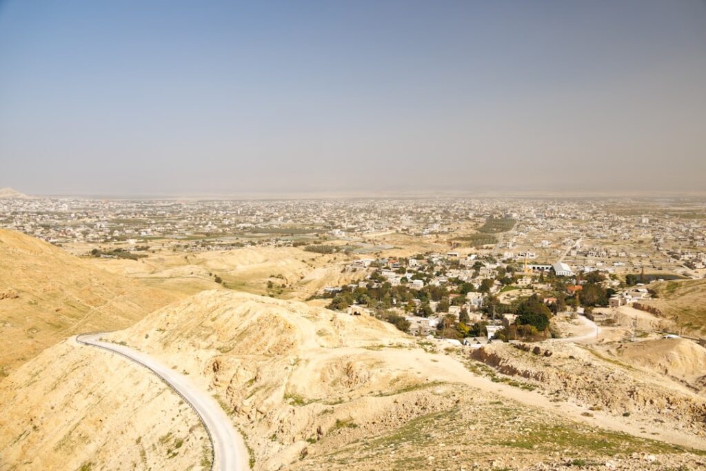 Panoramic view of a desert city with winding roads