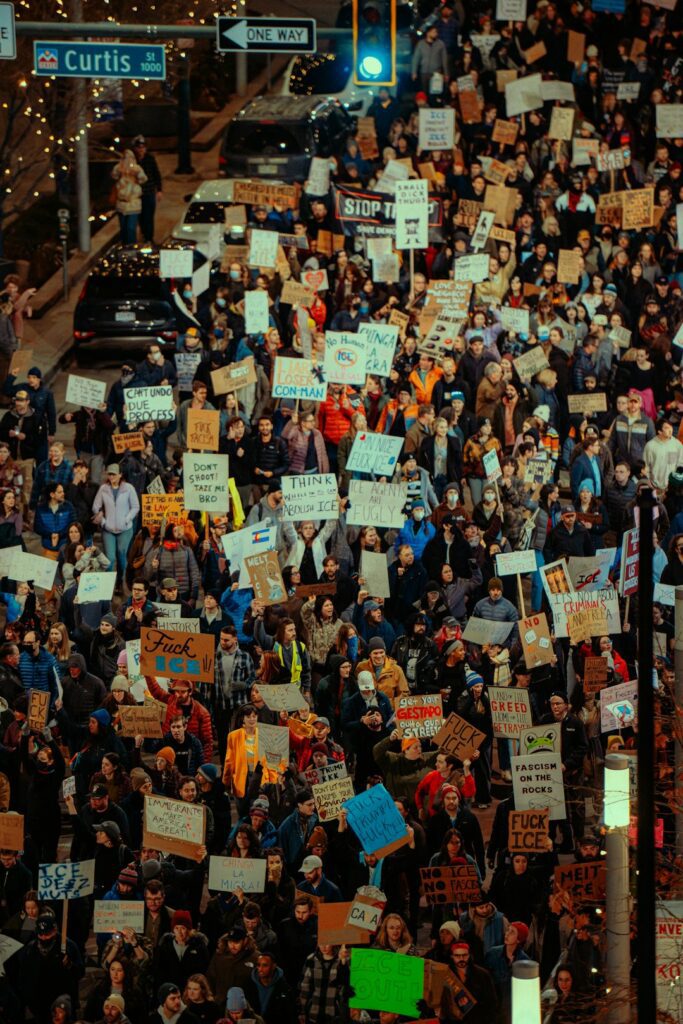 Crowd of people holding signs at a protest