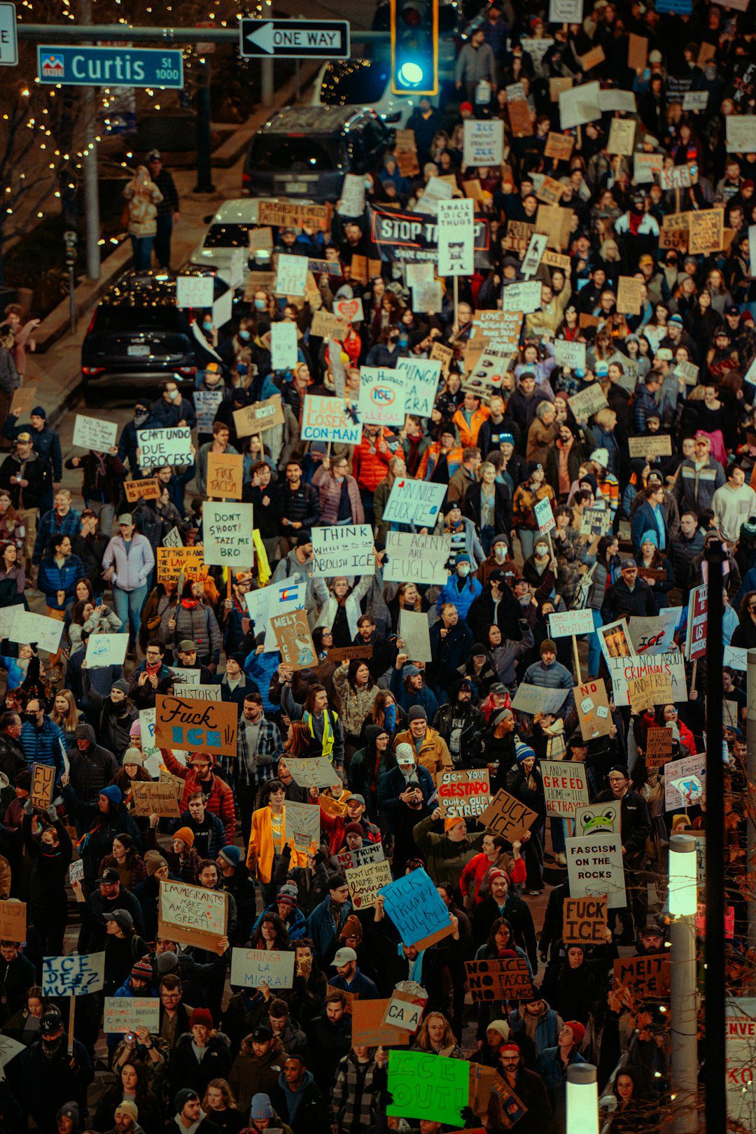 Crowd of people holding signs at a protest
