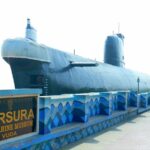 a large submarine sitting on top of a bridge