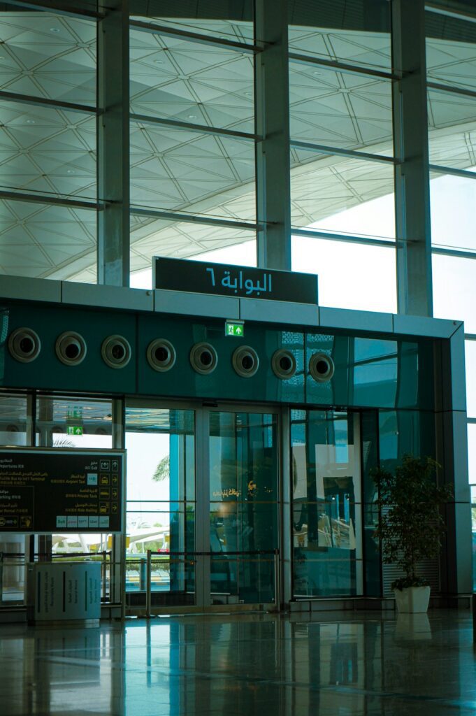 Modern airport interior with gate 6 sign and glass walls